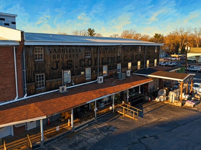 Historic J.S. Collins & Son lumber yard building at 300 Mill Street in Moorestown, New Jersey, with original painted sign for varnishes, brushes, and paints; now home to Townehaus behind Moorestown Hardware.